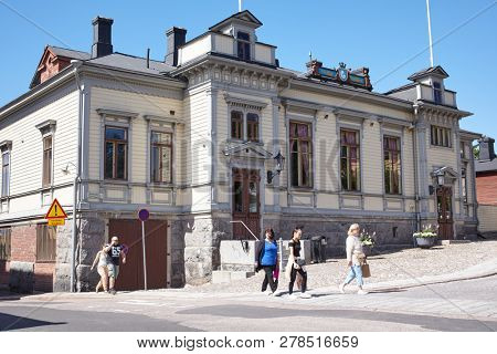 PORVOO, FINLAND - JULY 16, 2017: People at the building of Porvoo Volunteer Fire Brigade. The corps was founded in 1867 and its name was then the Voluntary Fire Brigade in Porvoo city