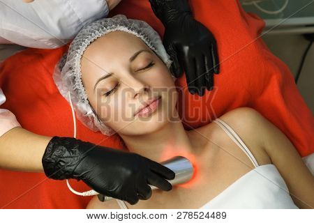 Hardware Cosmetology. Beautician Makes Ultrasonic Skin Tightening Client. Skin Pore Cleansing. Anti-
