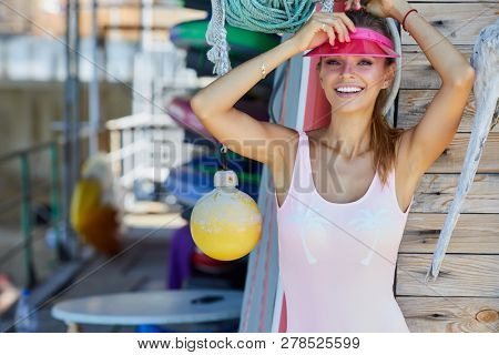 Woman With Her Surfboard At The Beach Stock Photo 