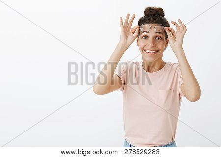 Waist-up Shot Of Happy Girl Cheering, Feeling Joyful As Taking Off Glasses And Putting On Contact Le