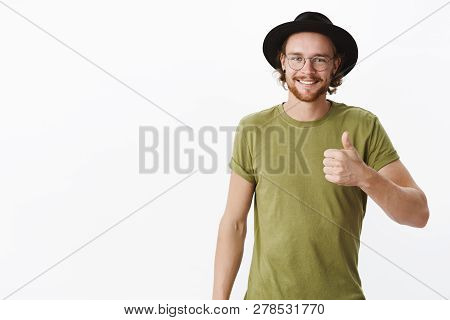 Keep Up You Doing Great. Portrait Of Proud And Satisfied Charismatic Young Male With Beard And Pierc