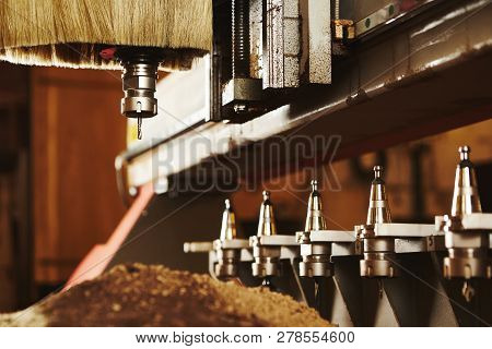 Machine With Numerical Control For Cutting Wood With Various Router Bits.