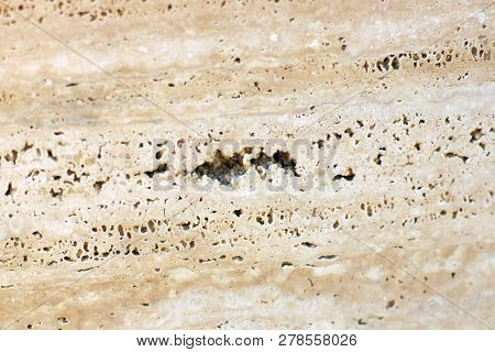 Beautiful Background Of Natural Stone Marble Beige In Cracks And Holes That Are Filled With Glue, Ca