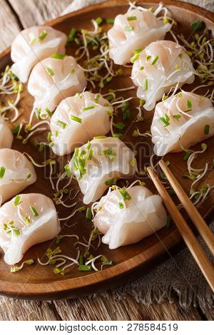 Chinese Dim Sum With Shrimps Served With Microgreen Close-up. Vertical