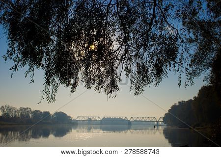 Summer Landscape Wide River. In The Distance, The Railway Bridge Across The River Is Visible. From A
