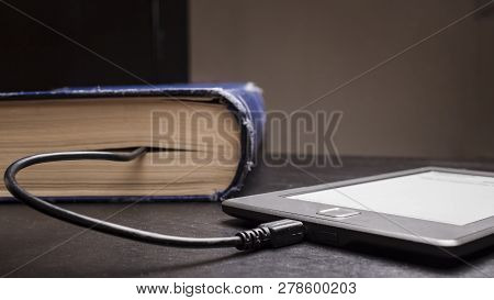 Concept Of Progress And Compactness, Ebook Connected To The Old Thick Blue Book With A Cable, And Do