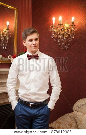The Groom Stands With His Hands Folded In His Pockets. Wedding. Presentable View.