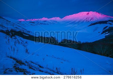 Wonderful View Of Castelluccio Di Norcia And Vettore Mountain At Dusk In The Monti Sibillini Nationa