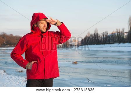 Guy Wear Jacket With Hood On Frosty Winter Day. Man Bearded Stand Warm Jacket Snowy Nature Backgroun