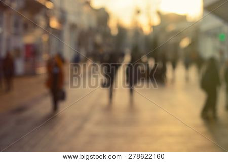 City Commuters At Sunset. Blurred Background Image For Business, Modile Apps, And Other Uses.