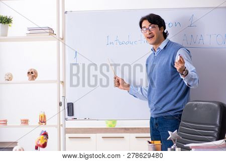Young lecturer teacher teaching anatomy