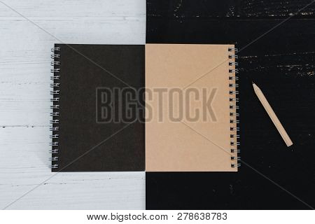 Black And Sand Sprial Notebooks On Black And White Surface, Contrasty Minimalist Flatlay