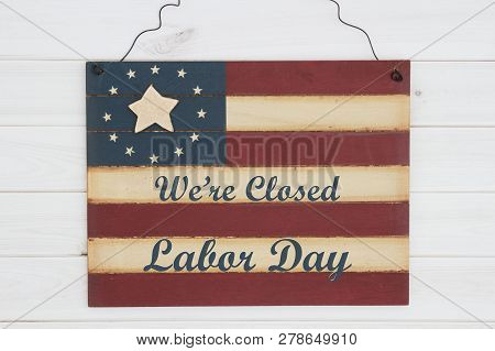 We Are Closed Labor Day Text On A Retro Wood American Stars And Strip Flag Sign On Weathered Wood