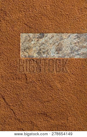Cocoa powder background, sifted over stone with negative copy space.