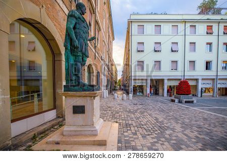 Rimini, Italy - June 13, 2018: Central Square Of Rimini Early In The Morning. Julius Caesar Statue I