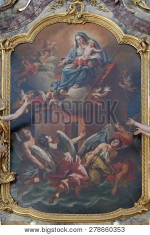 WURZBURG, GERMANY - JULY O4, 2018: Madonna with child Jesus, St. Michael altar in the Neumunster Collegiate Church in Wurzburg, Germany
