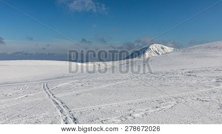 Trip Along The Krkonose Mountains Towards Snezka. Winter Ridges Of The Krkonose Mountains, In The Ba