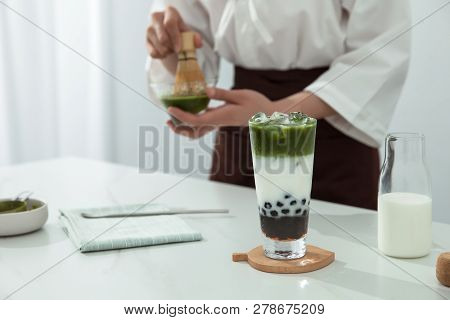 A Pretty Girl Is Making Maccha Brown Sugar Milk