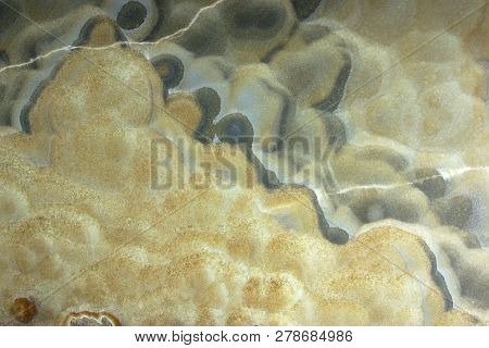 Background From A Light Natural Stone Onyx With Bubbles And Gray Stains On The Surface, Onix Naranja