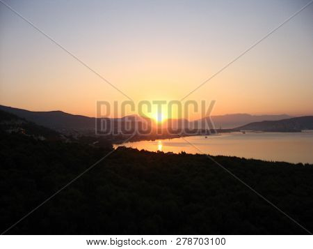 Harmonious View Of Colorful Dawning At The Adriatic Coast With The Sun Reflected In The Sea.