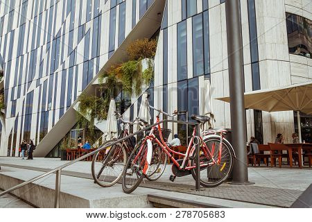October 27, 2018. Germany, Dusseldorf. City Folding Bicycle Parked Background Building Complex Known