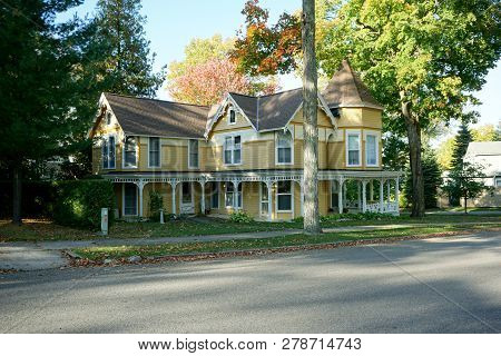Bay View, Michigan / United States - October 17, 2017: An Elegant Yellow Victorian Summer Cottage, W