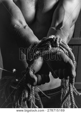 Young Man With Muscular Body Tied With Rope