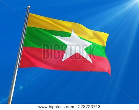 Myanmar - Burma National Flag Waving On Pole Against Deep Blue Sky Background. High Definition