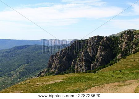 Photo Of Nature - Fantastic Petrous Mountain Slope With Bright Blue Sky