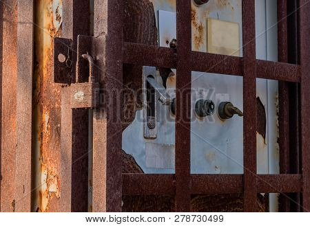 Old Disused Electrical Switch Box With Signs Of Damage Inside A Rusty Metal Utility Box Security Cag