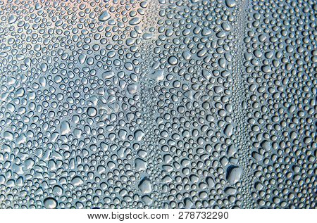 Drops Of Condensed Water On The Transparent Surface Of The Bottle.