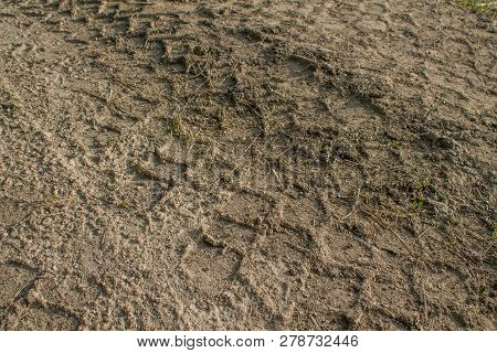 A Trace From The Car Wheel On Dusty Ground.