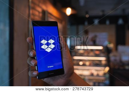 Chiang Mai, Thailand - June 09,2018: Man Holding Huawei With Dropbox On Screen. Dropbox Is A Service