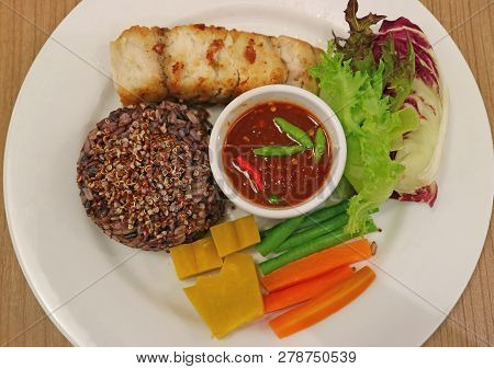 Thai Style Grilled White Seabass Served With Steamed Rice-berry Rice And Quinoa, Fresh And Boiled Ve