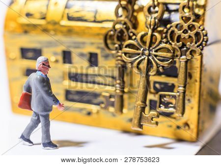 Savvy Successful Businessman Investment Guru Expert Choosing Golden Success Keys To Open Gold Treasu