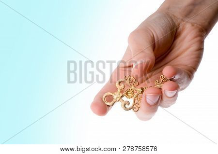 Hand Holding An Isolated Paper House With A White Background