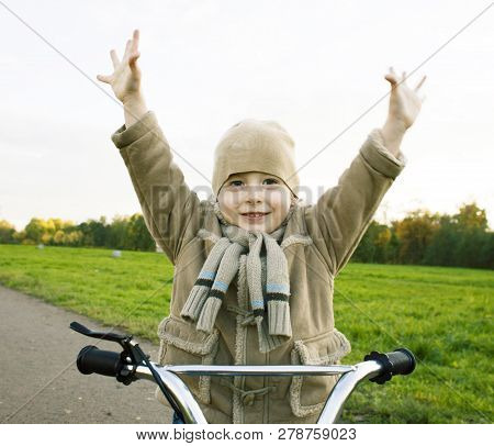 Little Cute Real Boy On Bicycle Emotional Smiling Close Up Outsi