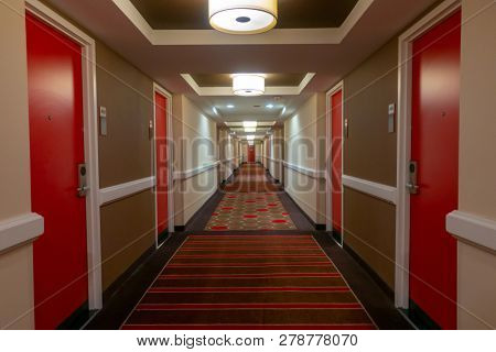 POV of walking in long corridor at a hotel