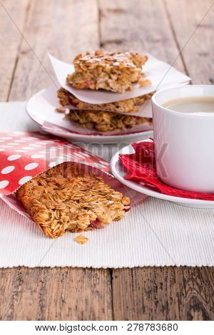 Flapjacks And Cup Of Coffee. Homemade Healthy Oat Bars With Honey And Currant. Flapjacks And Cup Of 