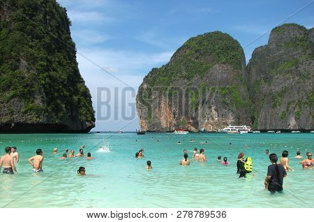 Maya Bay, Thailand - December 7, 2013: Tourists And Boats On The Famous Beach In Maya Bay On Phi Phi