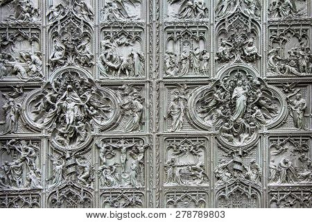 Detail Bronze Bas-reliefs Of The Pieta Scene In Bas-relief At Milan's Cathedral Doors