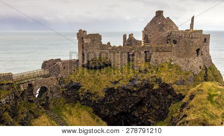 View On The Coastal Dunluce Castle Ruins In Northern Ireland.