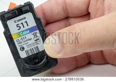 Benon, France - January 15, 2019: Canon 511 (color) Inkjet Cartridge Holding In Hand Of Man With Pro
