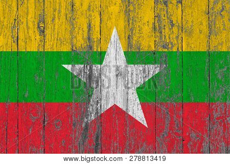 Flag Of Myanmar - Burma Painted On Worn Out Wooden Texture Background.