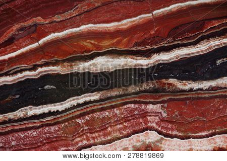 Natural Stone Of Red Color With A Pattern Called Onice Fantastico