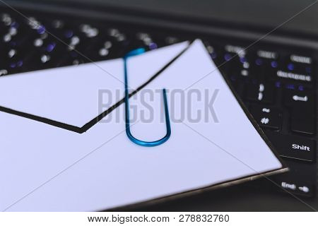 Laptop Keyboard With Envelope And Clip Symbol Of Email Attachments, Close-up Shot At Shallow Depth O