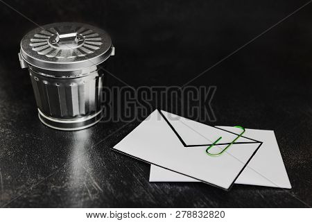 Envelope With Clip Symbol Of Email And Attachments With Trash Can Next To It