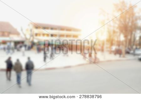 Blurred Image Of People Walking Across The Street And Crowd Around The Market In Ifrane, Morocco.