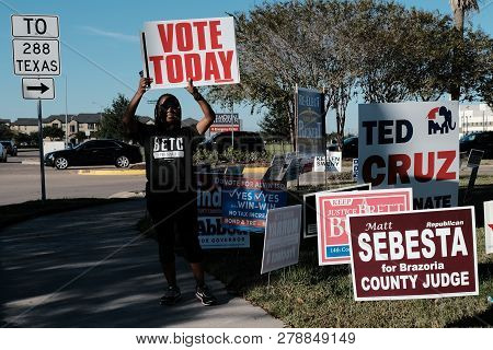 City Of Pearland, Texas - November 2, 2018: A Volunteer Holding Vote Today Sign Outside Voting Stati