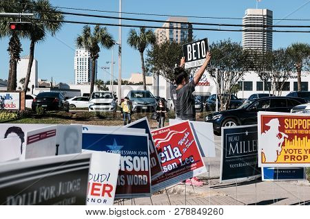 Houston, Texas - November 2, 2018: A Volunteer Holding Beto For Senate Sign Outside Voting Station I